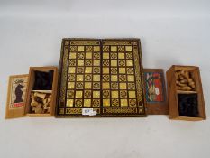 Two vintage chess sets (one lacking a piece) contained in original boxes,