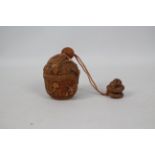 A single case carved wood inro in the form of a basket with mice and a snake,