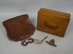A Mauchline ware box depicting views of Harrogate an Art Nouveau style copper crumb tray,