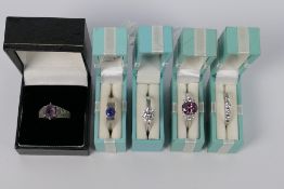 Five white metal, stone set rings, sizes R to U, each stamped 925 or Silver,