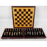 Chess Set - A chess board box with pieces contained in two drawers, king approximately 6 cm (h).