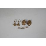 A pair of 9ct yellow gold drop earrings, a further pair of earrings of shell form,