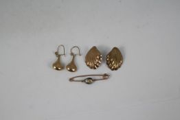 A pair of 9ct yellow gold drop earrings, a further pair of earrings of shell form,