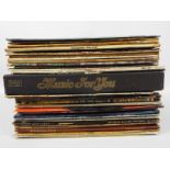 A collection of 12" vinyl records to include The Smiths, Rolling Stones, David Bowie, Pink Floyd,