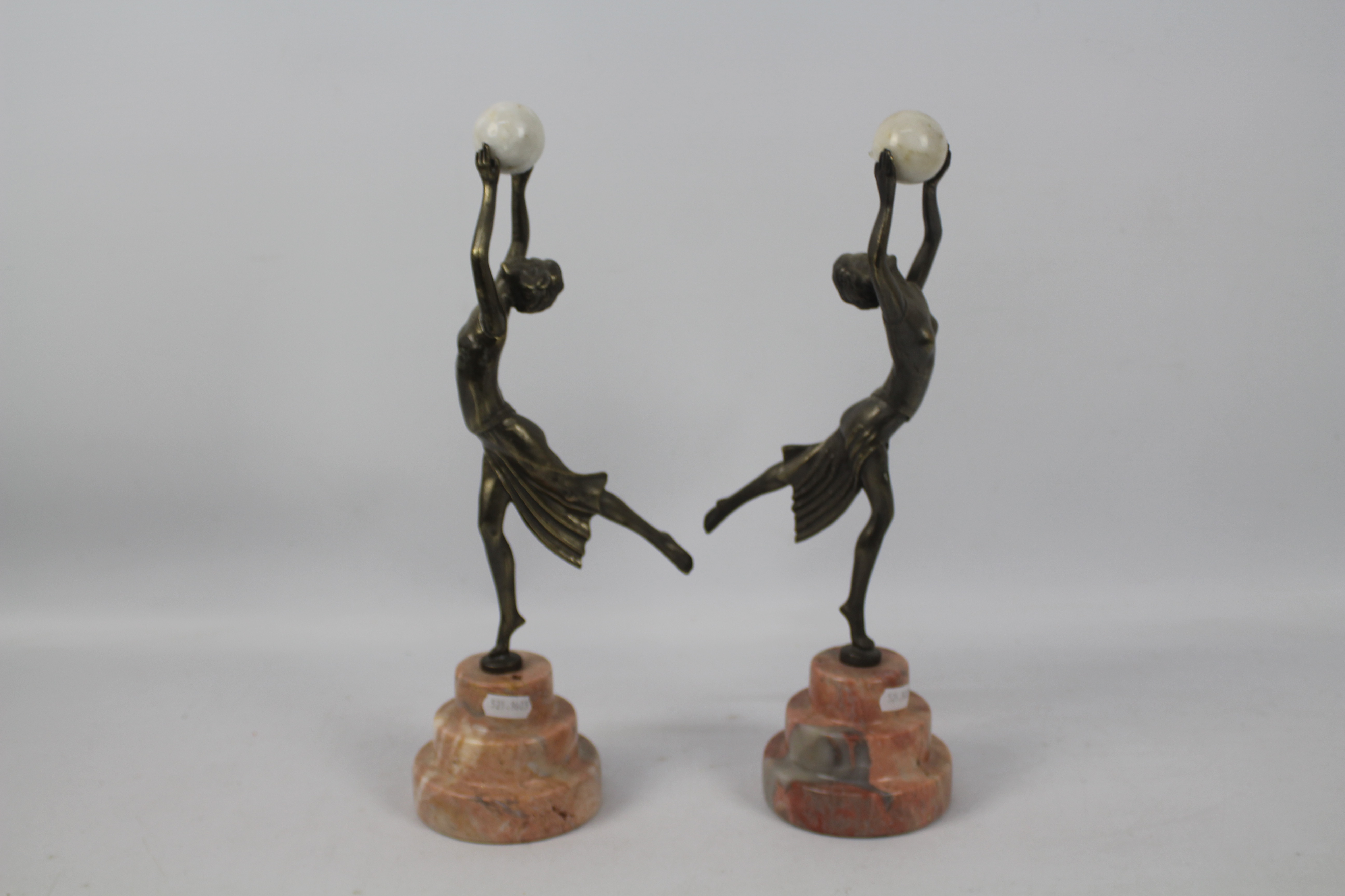 A pair of Art Deco style sculptures modelled as female figures holding aloft spheres, - Image 3 of 6