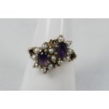 A lady's yellow metal (presumed 9 ct) dress ring set with amethysts and pearls, approx weight 3.