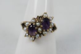 A lady's yellow metal (presumed 9 ct) dress ring set with amethysts and pearls, approx weight 3.