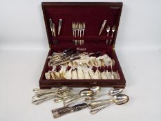 A canteen of plated cutlery along with further loose plated flatware.