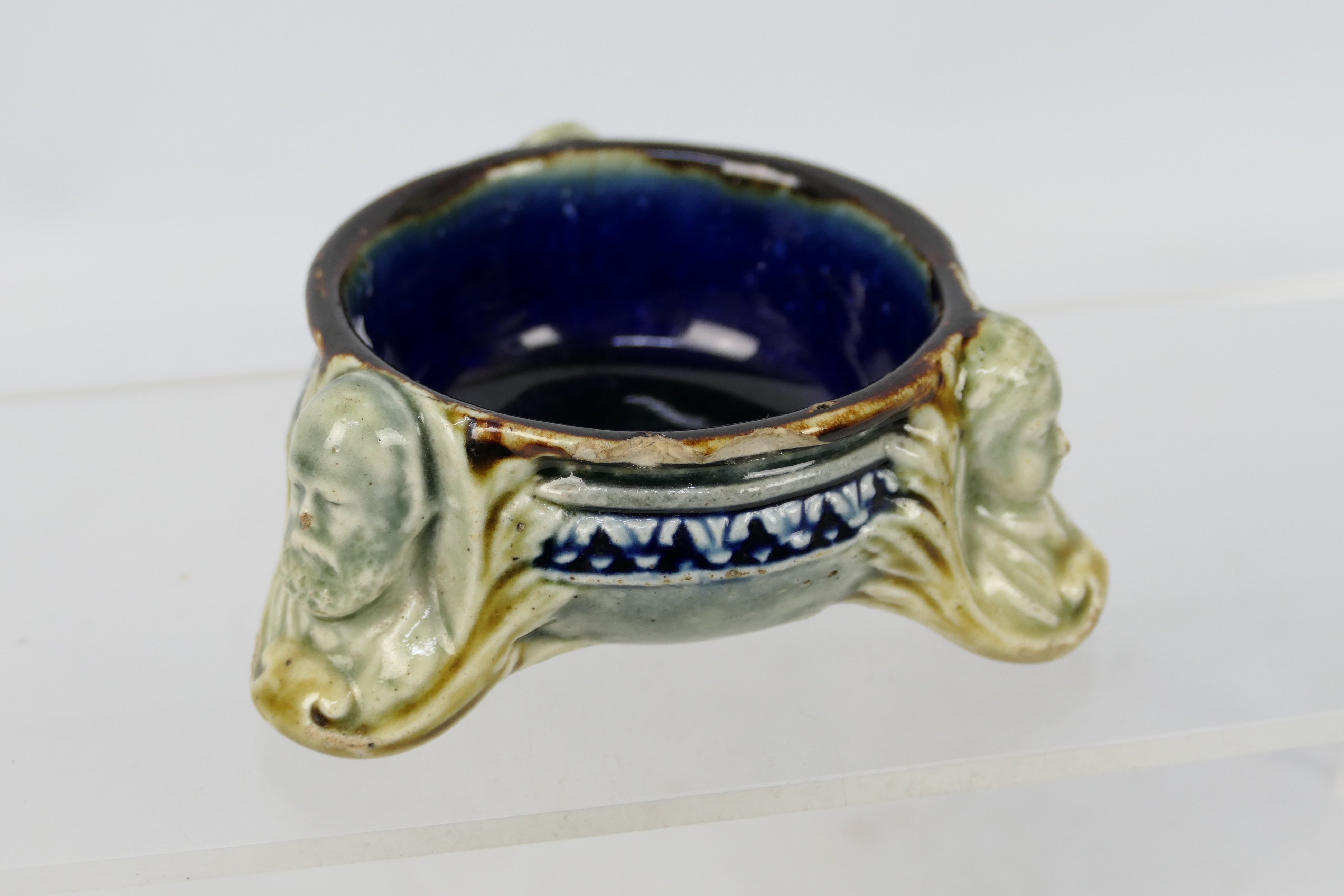 A Doulton Pottery stoneware salt cellar by George Tinworth,