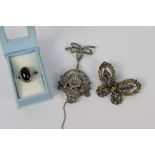 An attractive white metal brooch with nurse's style watch,
