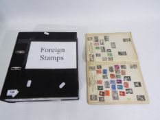 Philately - A Hunter stamp album containing a collection of UK and foreign stamps,