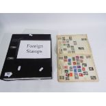 Philately - A Hunter stamp album containing a collection of UK and foreign stamps,