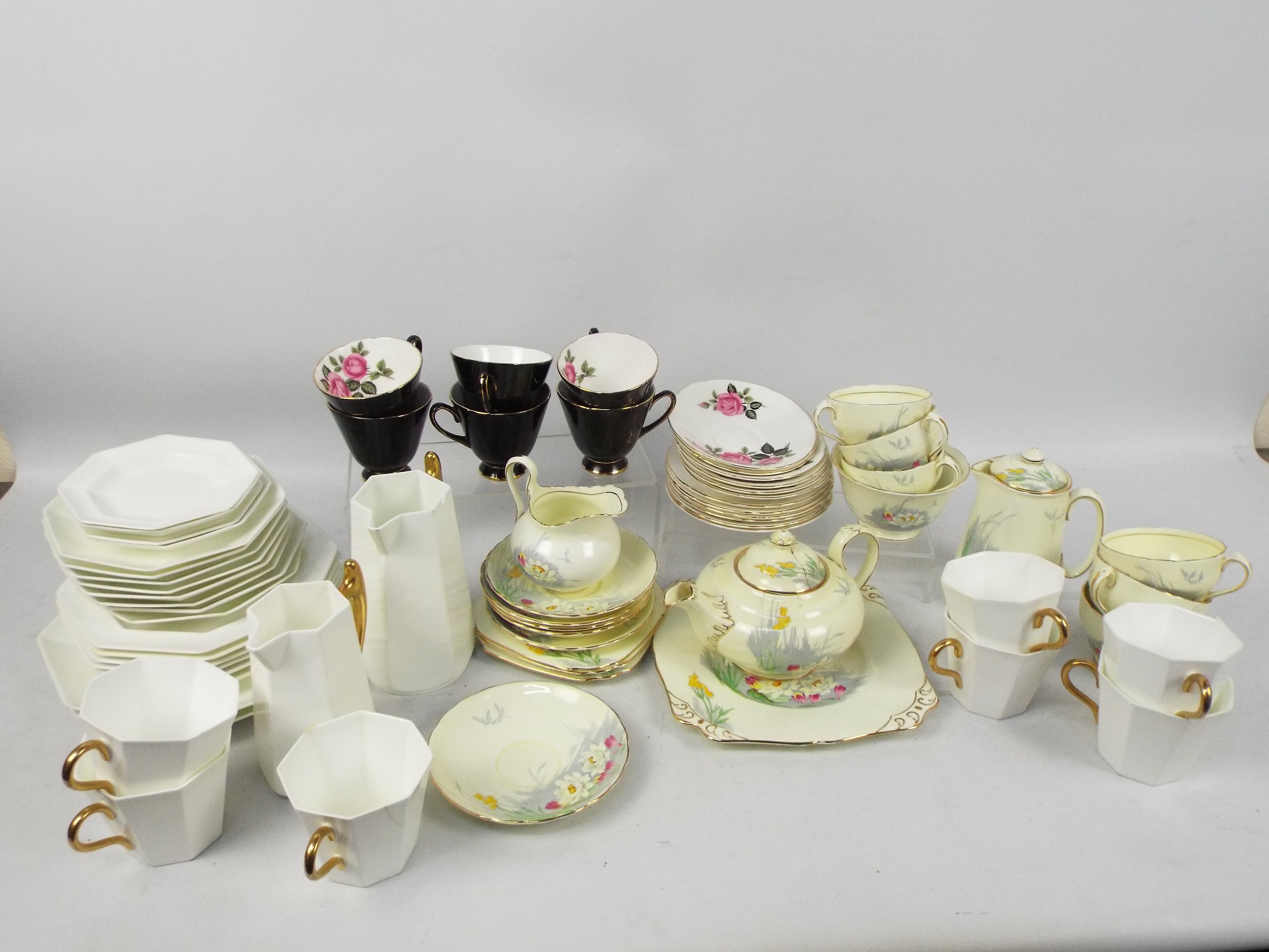 Three part tea services to include New Chelsea Water Lily pattern,