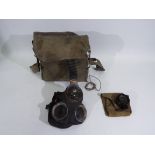 A World War Two (WW2 / WWII) chest respirator and haversack,