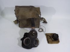 A World War Two (WW2 / WWII) chest respirator and haversack,