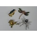 Four costume jewellery brooches in the form of animals to include spider, frog,