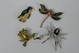 Four costume jewellery brooches in the form of animals to include spider, frog,