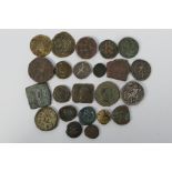 A collection of metal detector find coins and tokens.