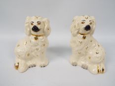 A pair of Royal Doulton Staffordshire style dogs, printed marks and impressed 1378 to the base,