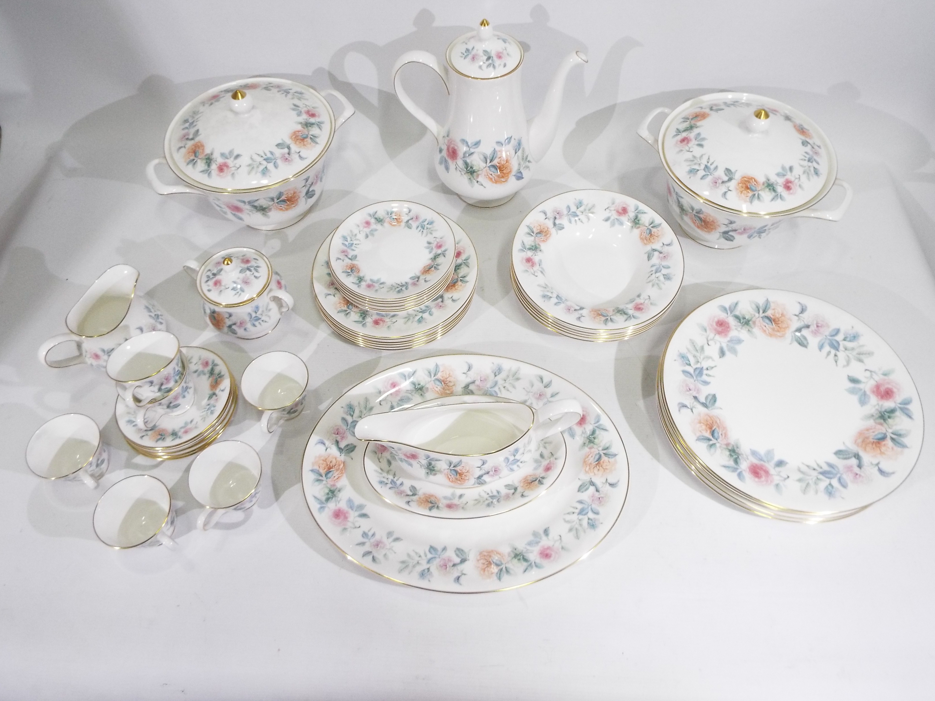 Wedgwood - A collection of dinner and tea wares in the Mist Rose pattern comprising dinner plates,