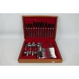 A vintage canteen of Viners stainless steel cutlery, six settings.