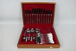 A vintage canteen of Viners stainless steel cutlery, six settings.