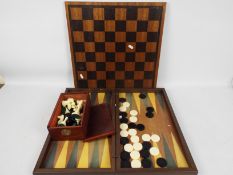 A chess set and board, king approximately 9 cm (h) and a folding backgammon board.