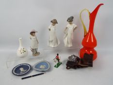 A mixed lot to include Nao figures, vintage camera, toy soldier,