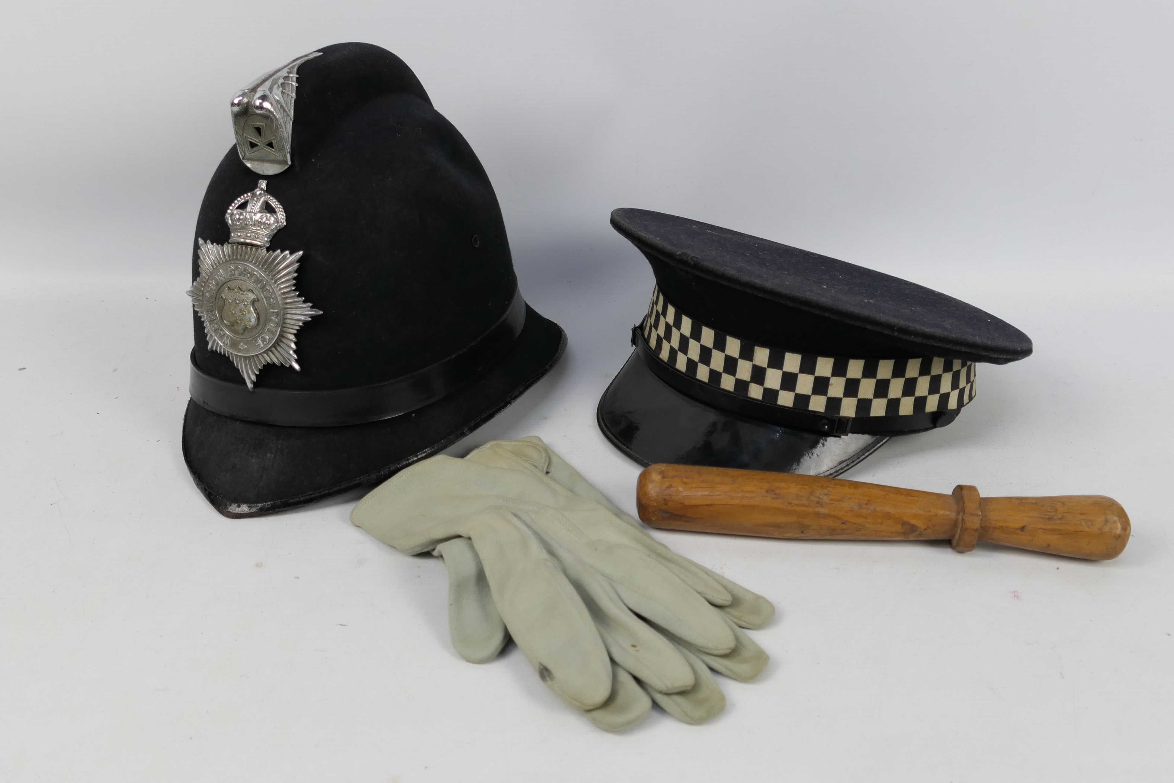 A vintage Warrington Borough Police helmet,