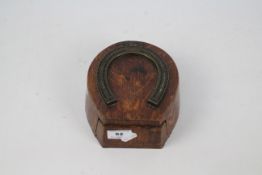 A late 19th or early 20th century cribbage scorer in the form of a horseshoe,