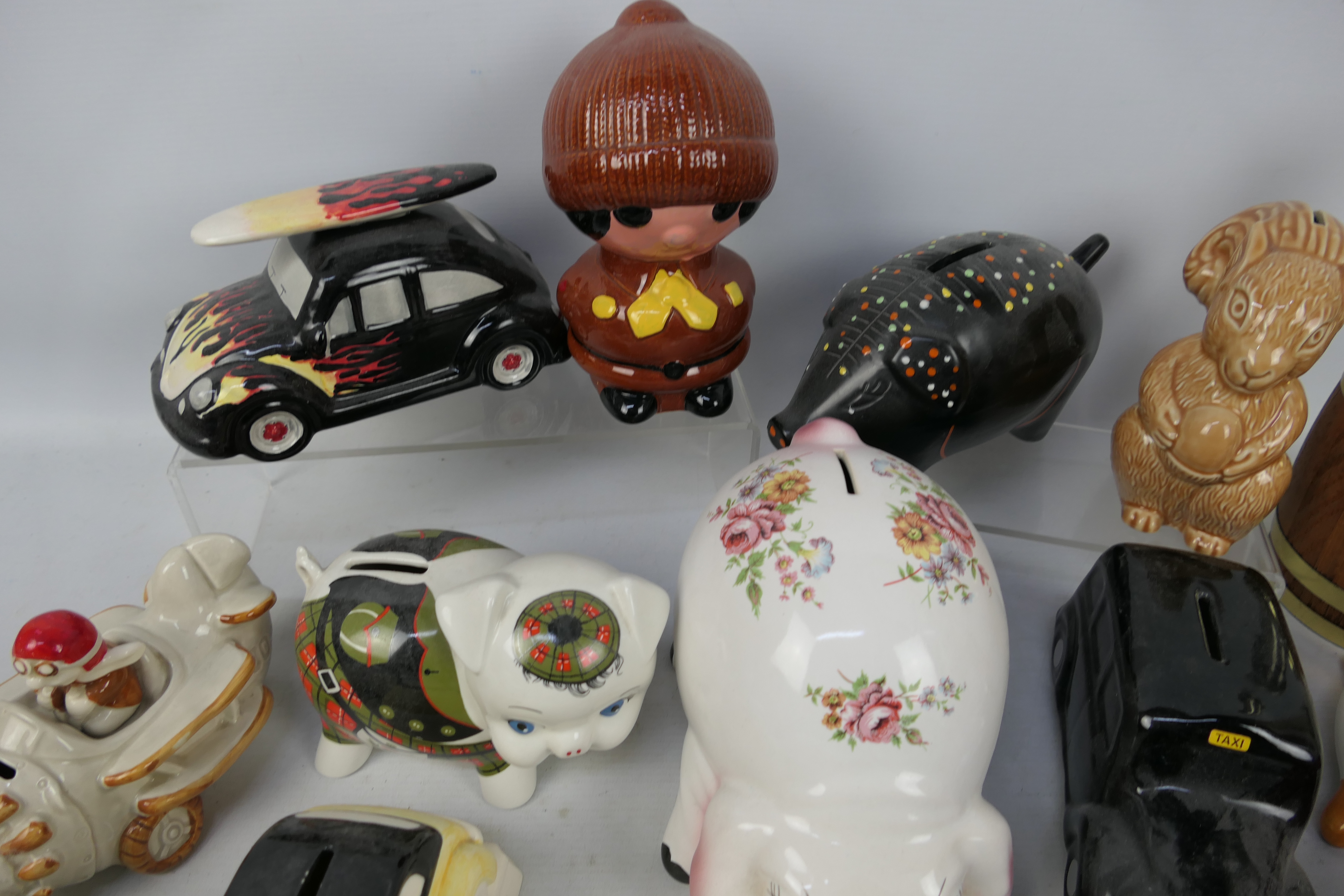 A collection of various money banks, predominantly ceramic, to include Wade. - Image 2 of 4