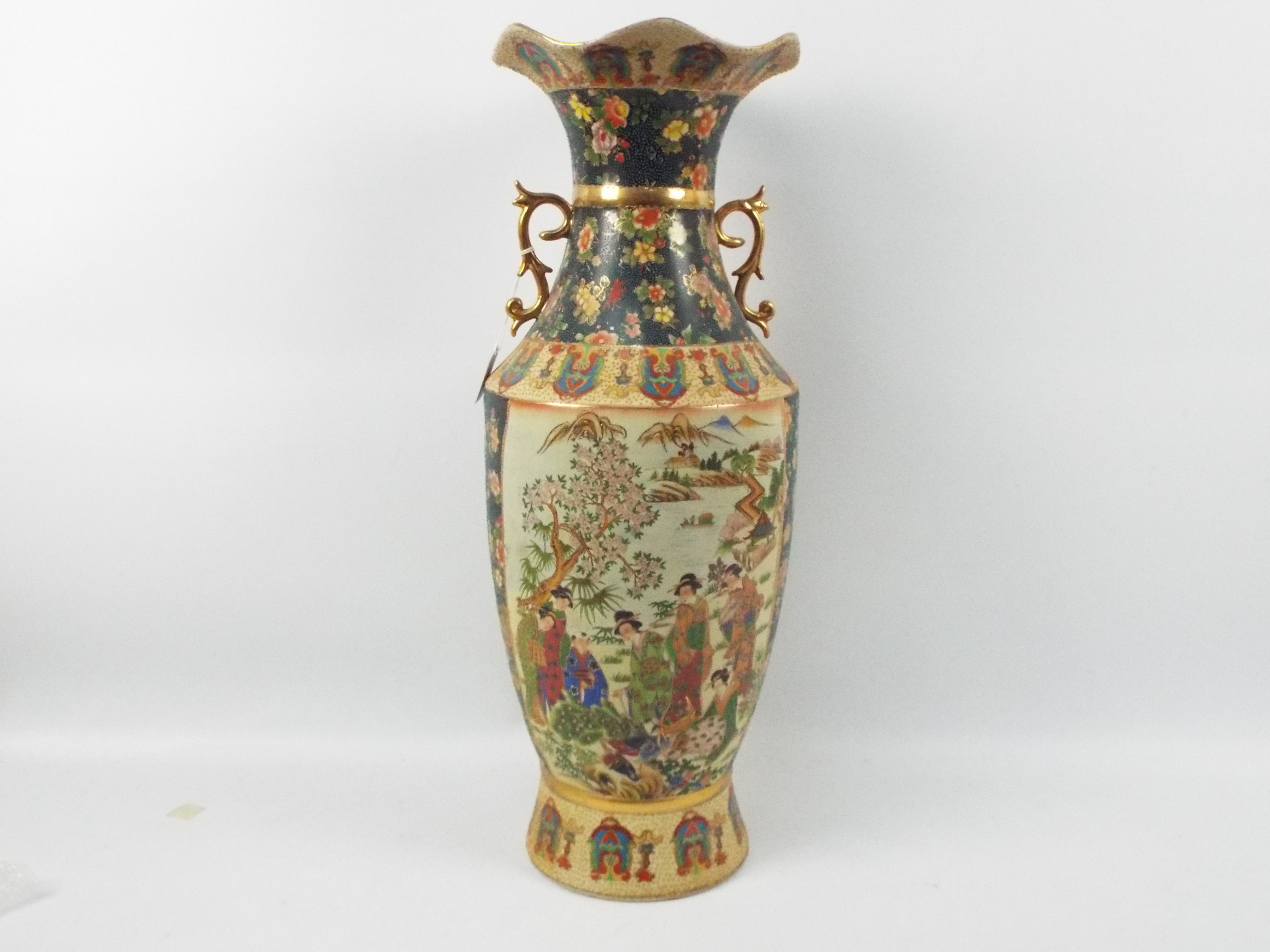 A large Japanese Satsuma ware vase with twin gilt handles decorated with two panels of figures in a - Image 7 of 10