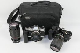 Photography - A Think Tank camera bag containing an Olympus OM2 with fitted OM-System 1:3.5 - 4.