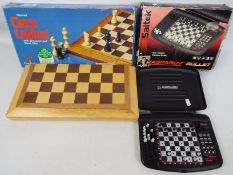 A vintage Cardinal chess set with folding board and 8 cm (h) king,