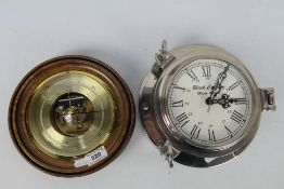 A wood and brass cased barometer (20 cm diameter) and a chromed bulkhead style clock.