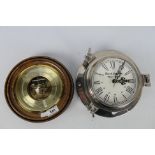 A wood and brass cased barometer (20 cm diameter) and a chromed bulkhead style clock.