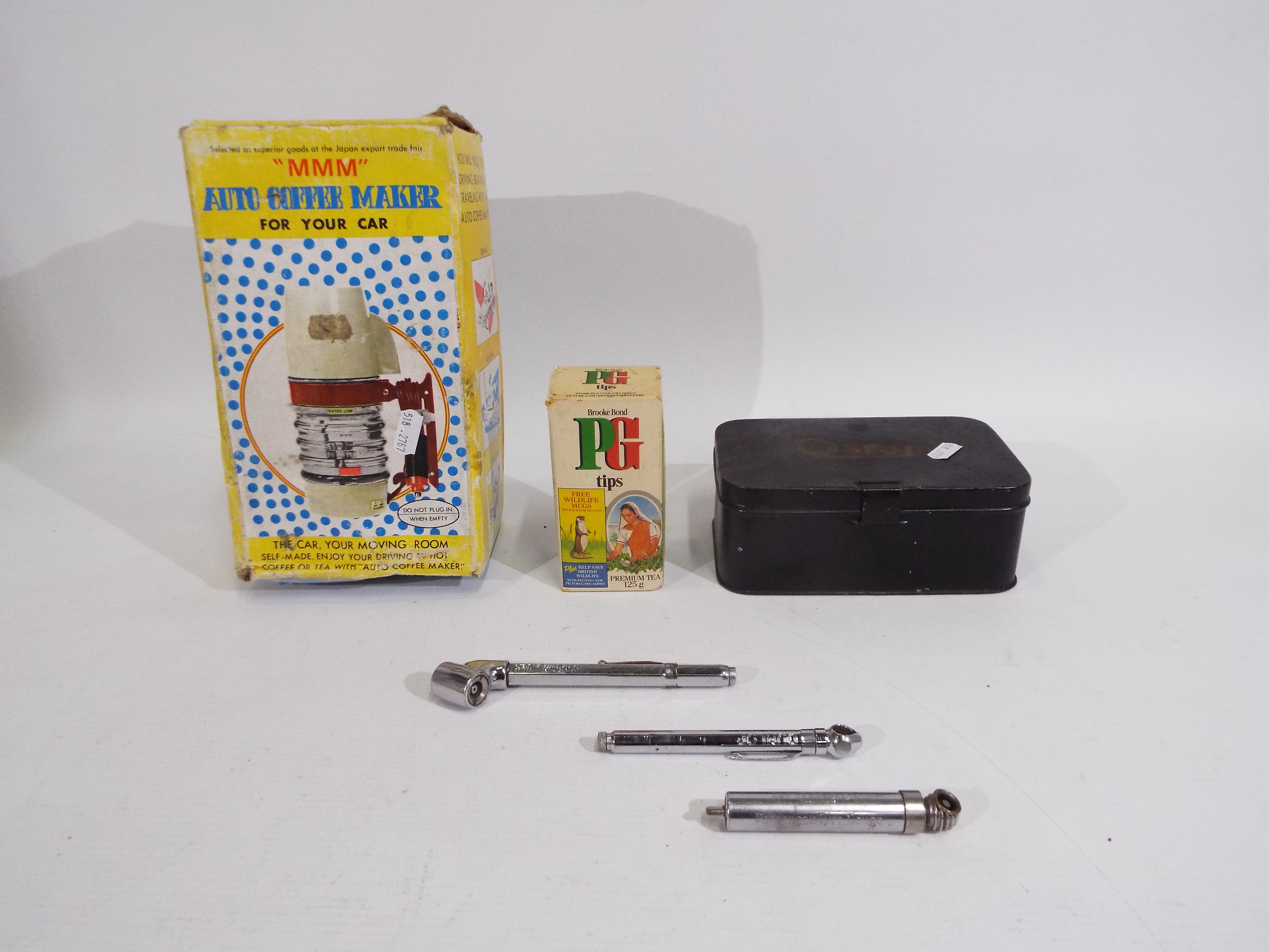 An Osram Bulb Kit tin containing a quantity of bulbs, car coffee maker,