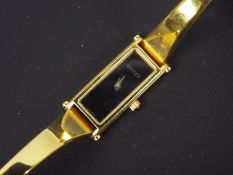 A lady's gold plated Gucci wrist watch,