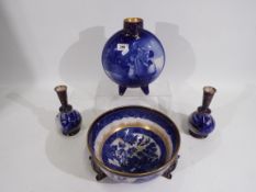 Doulton Burslem - Four pieces comprising a Willow pattern bowl raised on tripod supports, 24 cm (d),