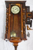 A Vienna-style weight-driven striking wall clock, walnut case with turned and applied decoration,