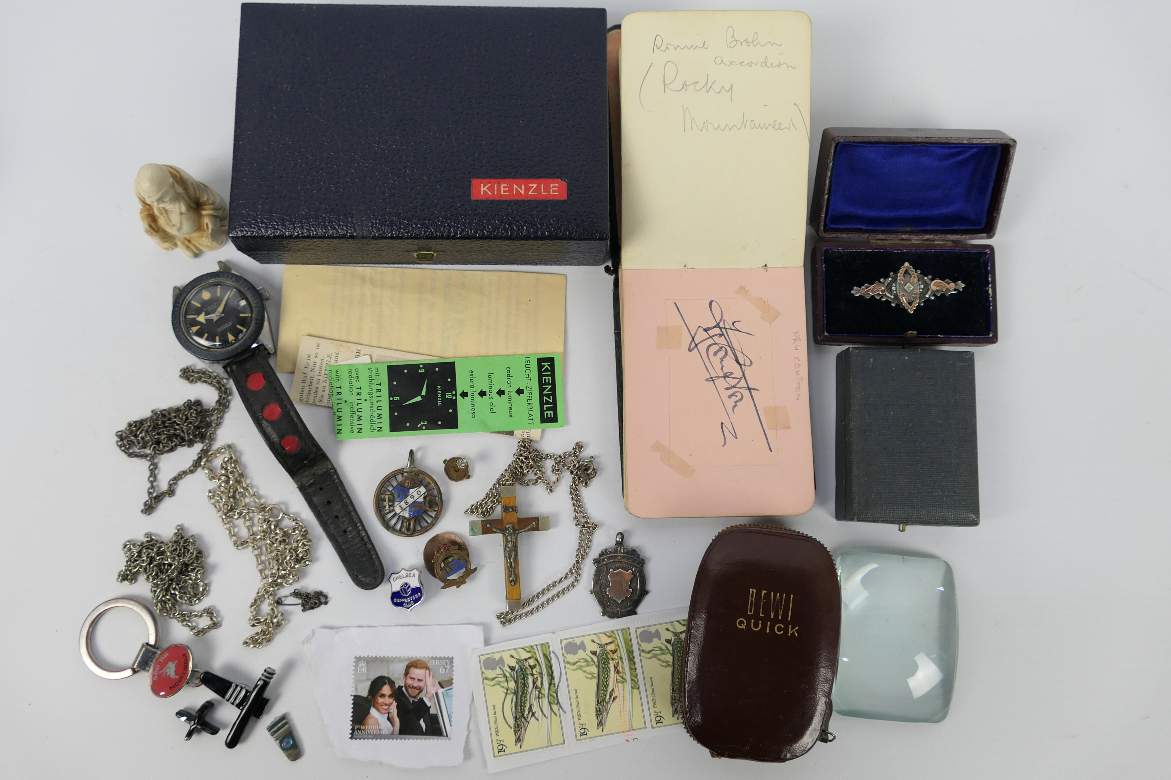 A mixed lot of collectables to include vintage autograph book, silver fob, bar brooch and necklace,