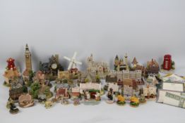 A collection of Lilliput Lane and similar models to include Big Ben, Buckingham Palace,