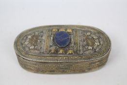 An Asian white and yellow metal trinket or jewellery box of oval section,