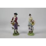 Volkstedt Porcelain - Two hand painted figures of flower pickers, one female, one male,