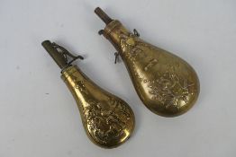 Two brass powder flasks one embossed with hunting scene and a US Model 1855 Peace or Zouave type.