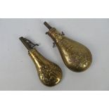 Two brass powder flasks one embossed with hunting scene and a US Model 1855 Peace or Zouave type.