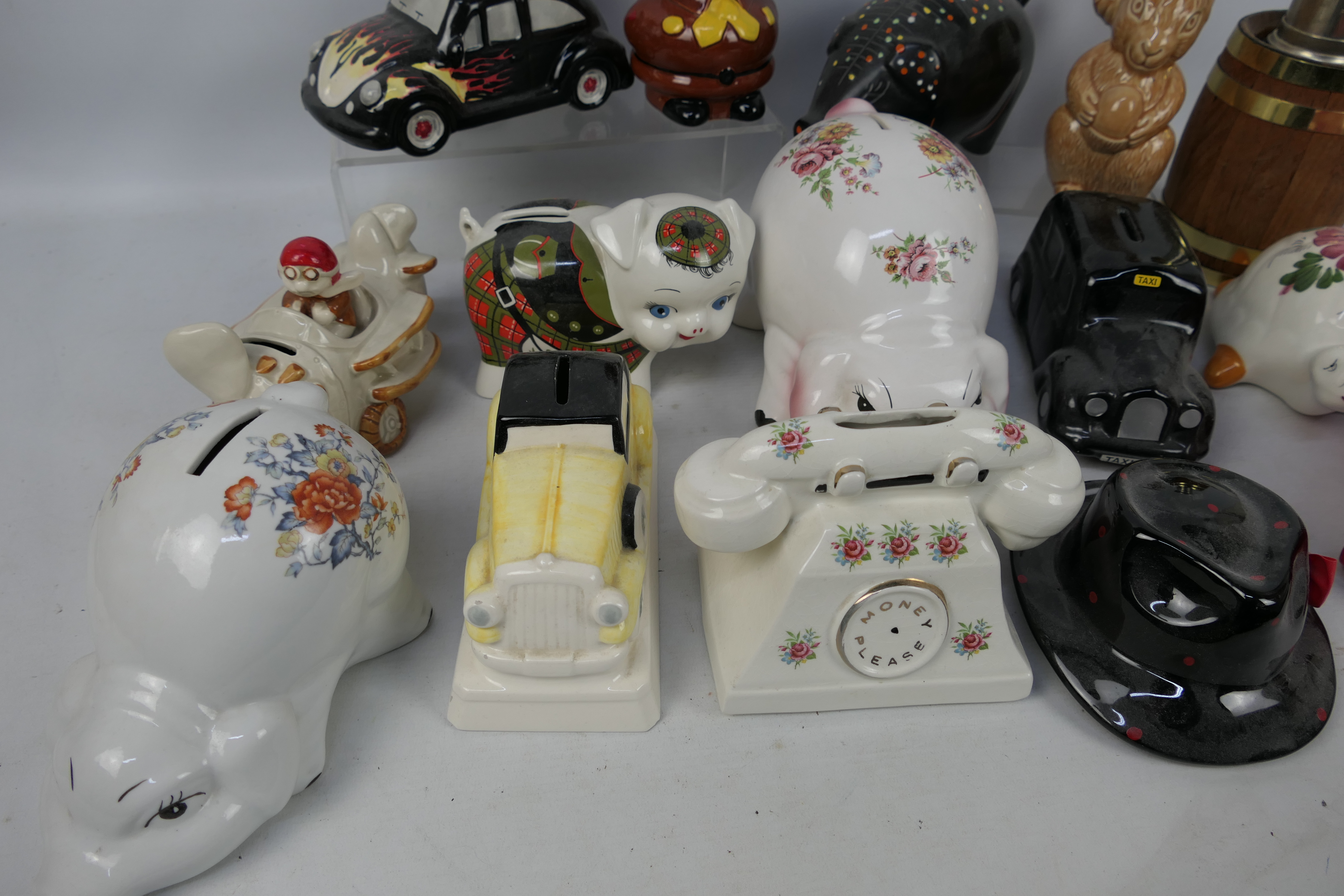 A collection of various money banks, predominantly ceramic, to include Wade. - Image 4 of 4