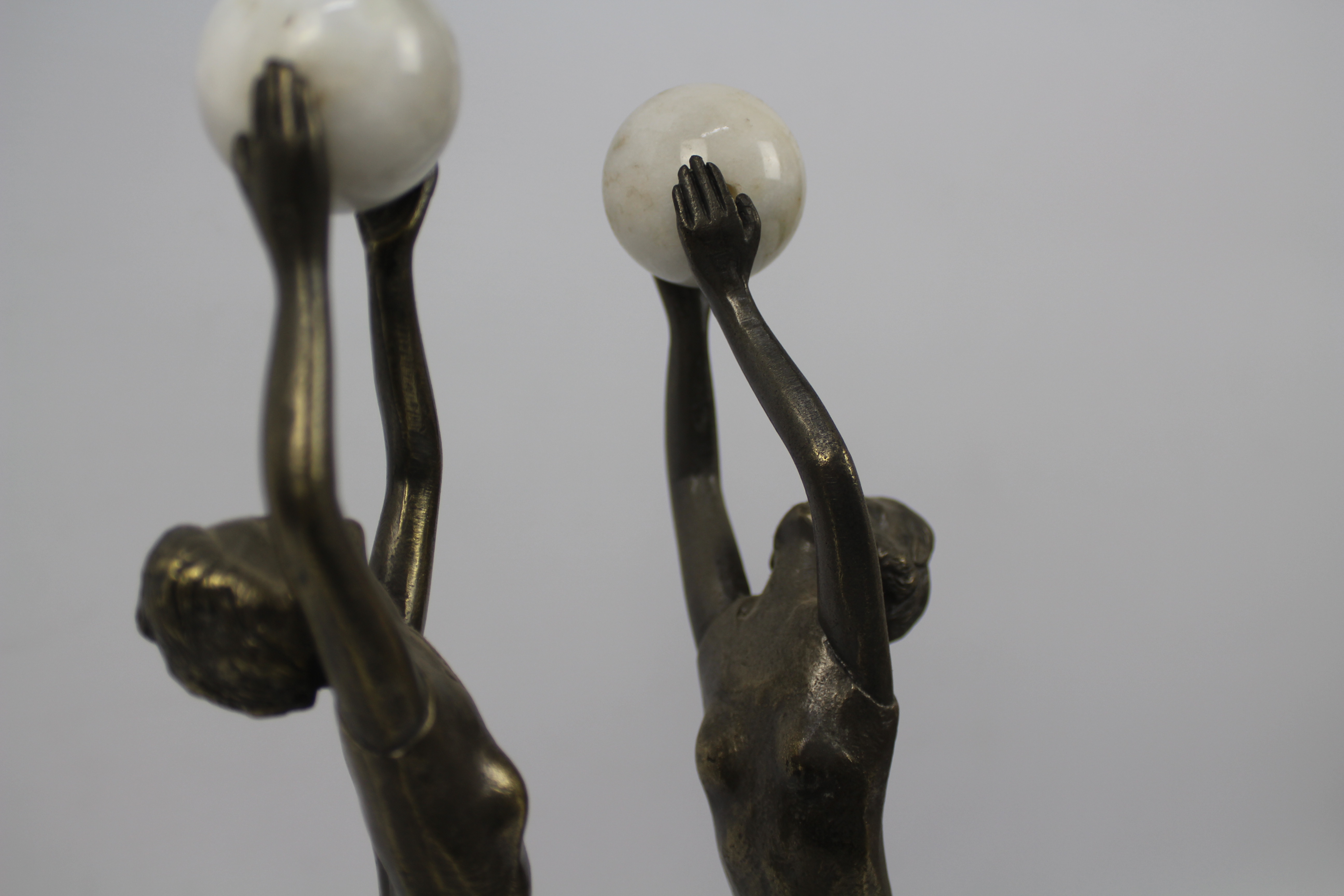 A pair of Art Deco style sculptures modelled as female figures holding aloft spheres, - Image 5 of 6
