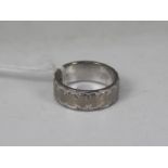 An 18ct white gold band ring, size K, approximately 6.8 grams all in.