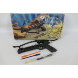 A boxed pistol crossbow with two plastic steel tipped bolts.